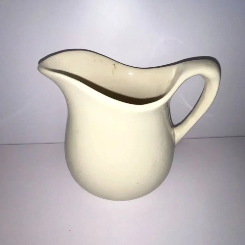 Beautiful vintage white stoneware pitcher; measures 6